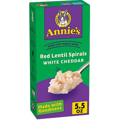 Annie's Red Lentil Spirals And White Cheddar, made with organic pasta, front of box.