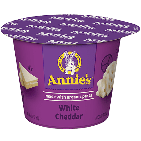 Annie's White Cheddar microwaveable mac and cheese cup, made with organic pasta, front of cup.
