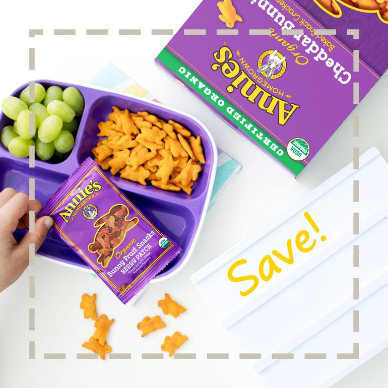 Lunch on table with Annie's Fruit Snacks and Cheddar bunnies with Save Callout for printable coupons