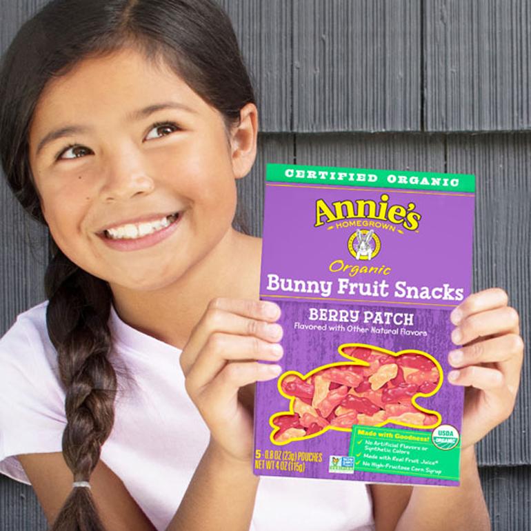 Girl Holding Annie's Bunny Fruit Snacks Box