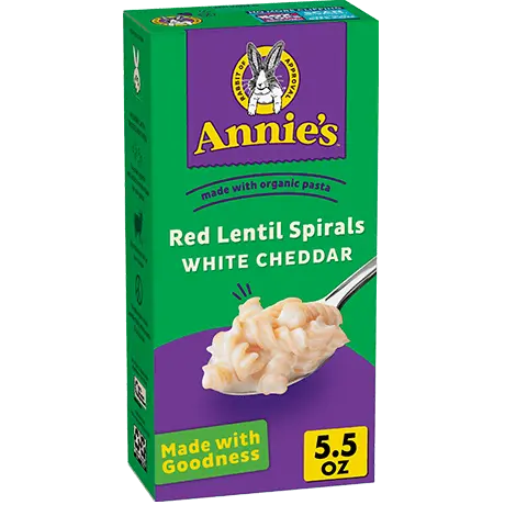 Annie's Red Lentil Spirals And White Cheddar, made with organic pasta, front of box.