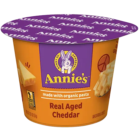 Annie's Real Aged Cheddar microwaveable mac and cheese cup, made with organic pasta, front of cup.