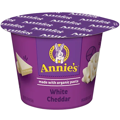 Annie's White Cheddar microwaveable mac and cheese cup, made with organic pasta, front of cup.
