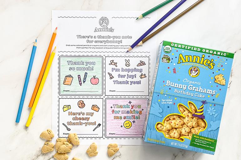 Annie's "There's a thank you note for every bunny" coloring activity sheet with a box of Bunny Grahams Birthday Cake and single Bunny Grahams and colored pencils.