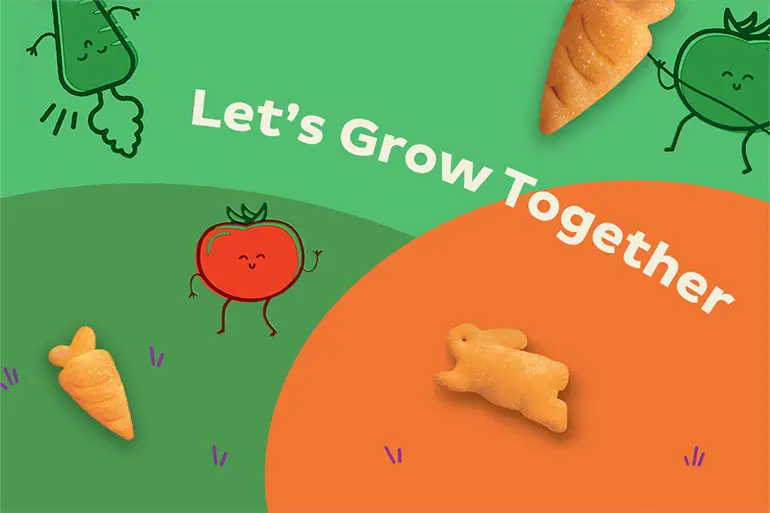 Illustration of veggies with arms and legs on a hill with a couple Annie's Cheddar Crackers and text that says, "Let's grow together".