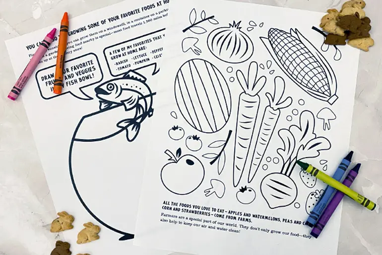 Annie's front and back coloring sheet activity with a pile of single Bunny Grahams and crayons on a table.