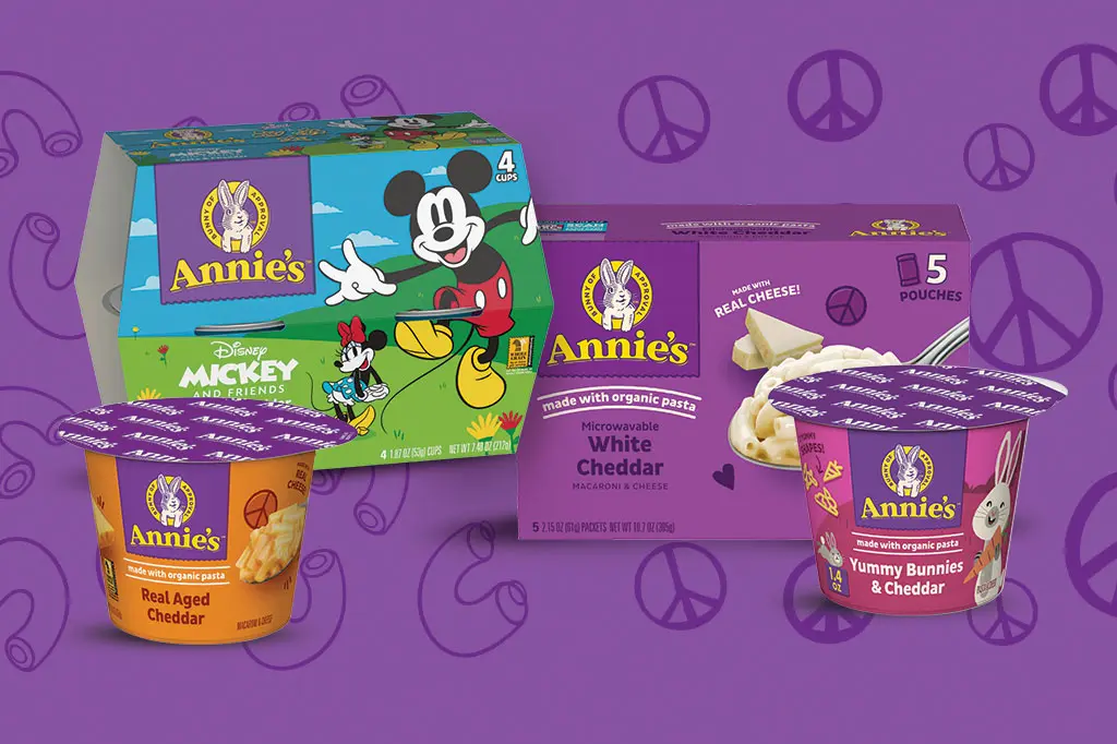 Single packages of Annie's Microwavable Mac on a purple background.