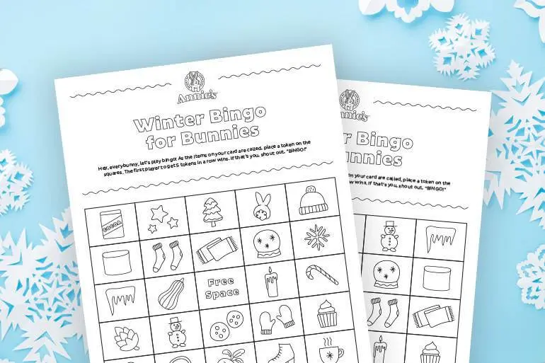 A black and white Annie's Activity sheet coloring page titled "Winter Bingo for Bunnies!" with a cartoons of a winter hat, stars and socks
