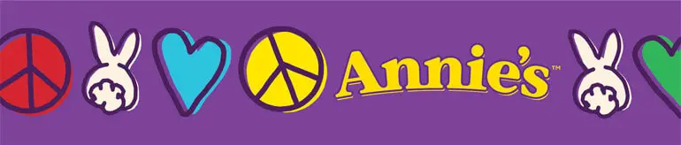Purple rectangle sticker with peace signs, bunnies, hearts, and the Annie's logo.